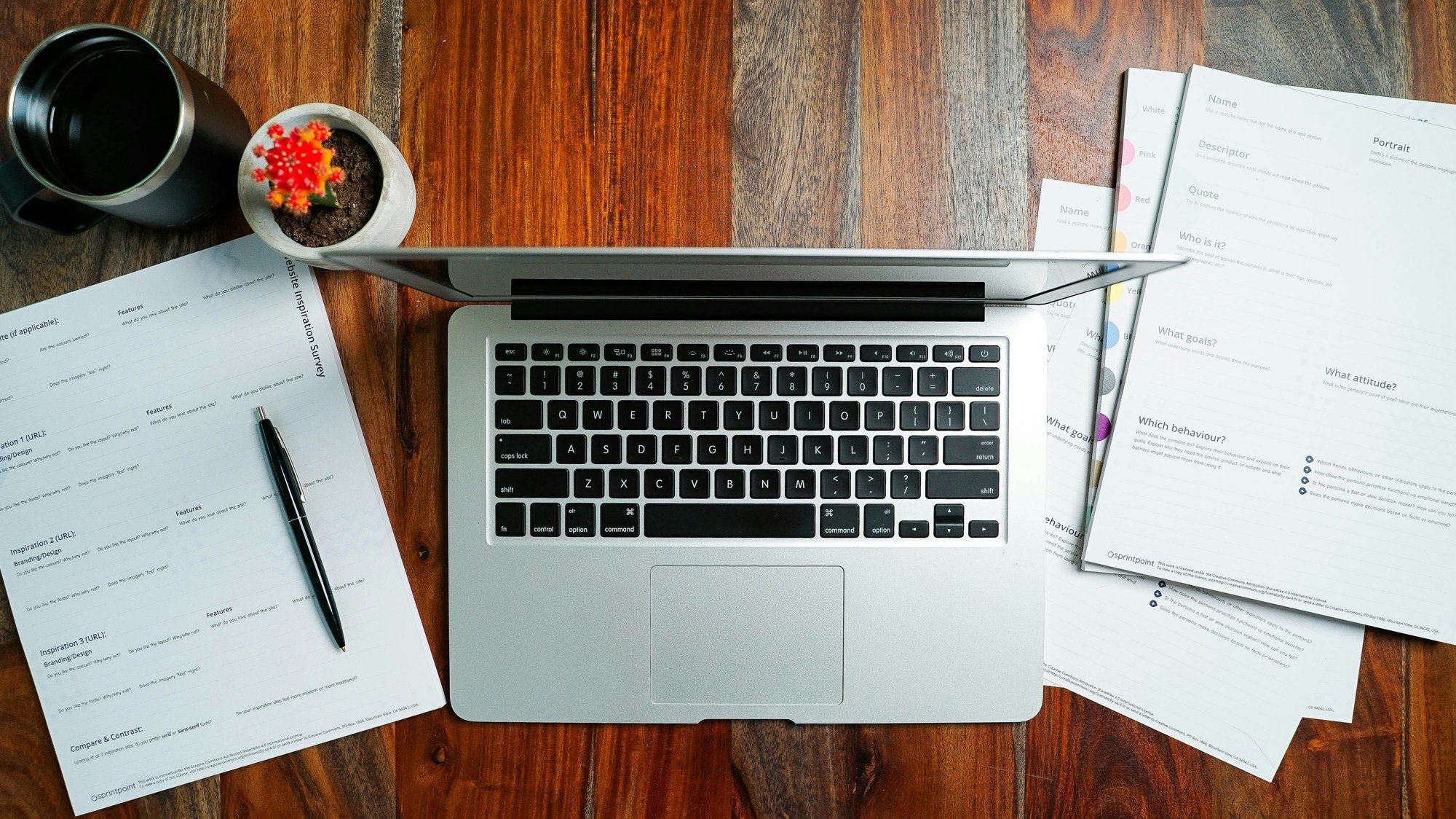 Laptop with organized printed materials Laptop with organized printed materials